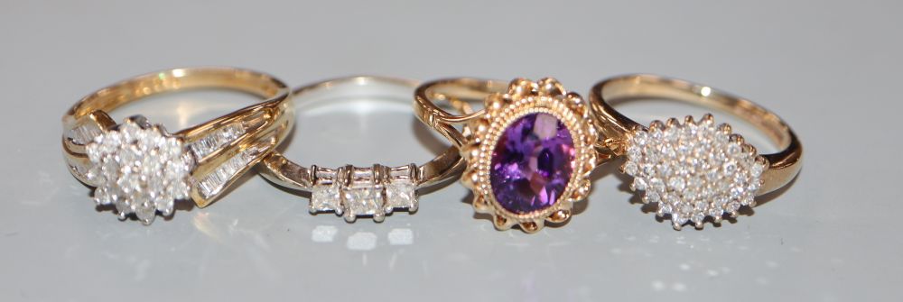Three assorted modern 9ct gold and diamond set dress rings and a 9ct gold and amethyst ring, gross 10.8 grams.